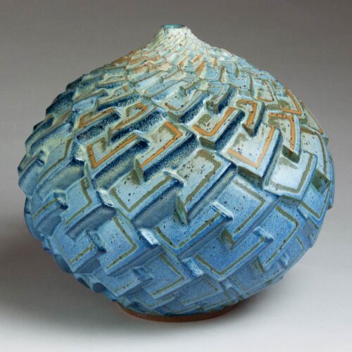 Angular Ascent - Scaled texture in blue, green, and orange ceramic pot